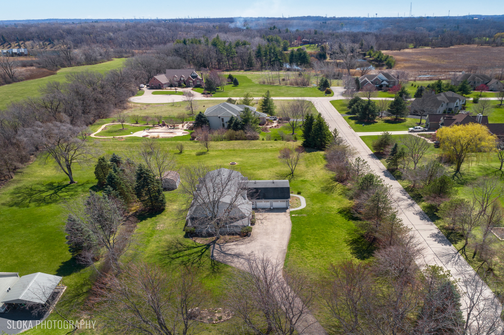 2401 West Wright Road Prairie Grove, IL 60012 - Photo 50 of 60 a view of a lake with a yard