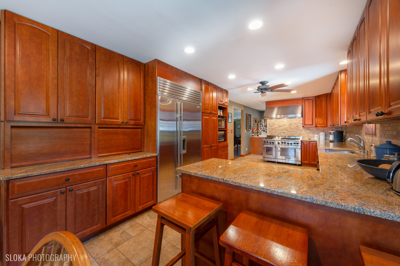 2401 West Wright Road Prairie Grove, IL 60012 - Photo 6 of 60 a kitchen with stainless steel appliances granite countertop wooden cabinets a stove a sink and dishwasher