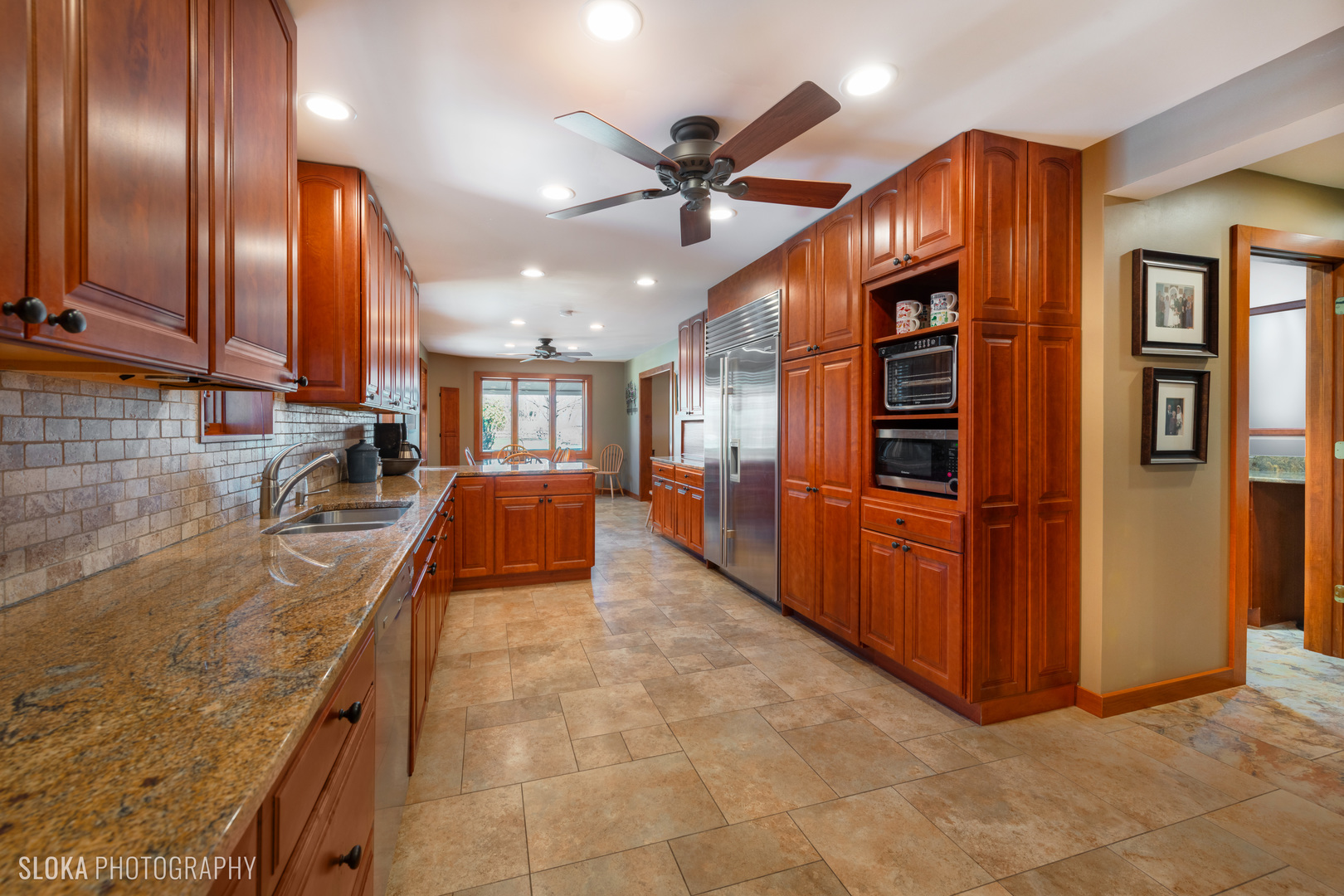 2401 West Wright Road Prairie Grove, IL 60012 - Photo 10 of 60 a kitchen with stainless steel appliances granite countertop a refrigerator and a sink