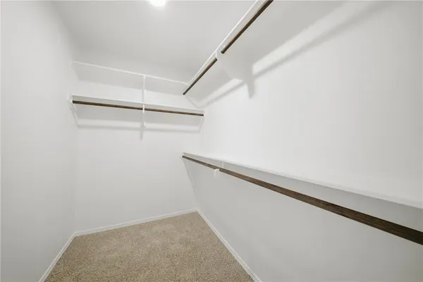 a view of an empty walk in closet