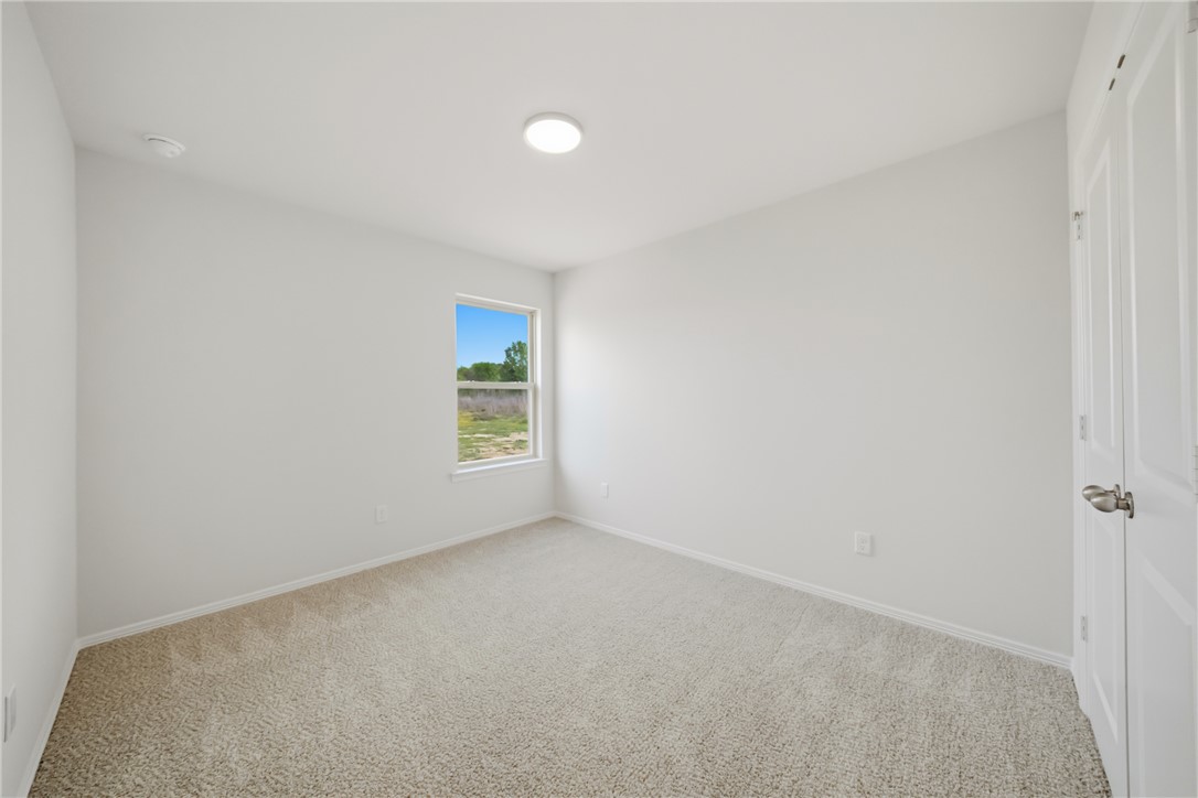 1220 High Street Navasota, TX 77868 - Photo 20 of 27 a view of an empty room with a window