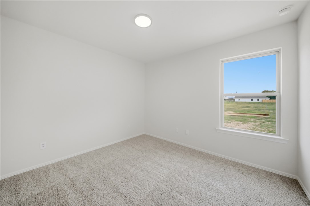 1220 High Street Navasota, TX 77868 - Photo 22 of 27 an empty room with a window