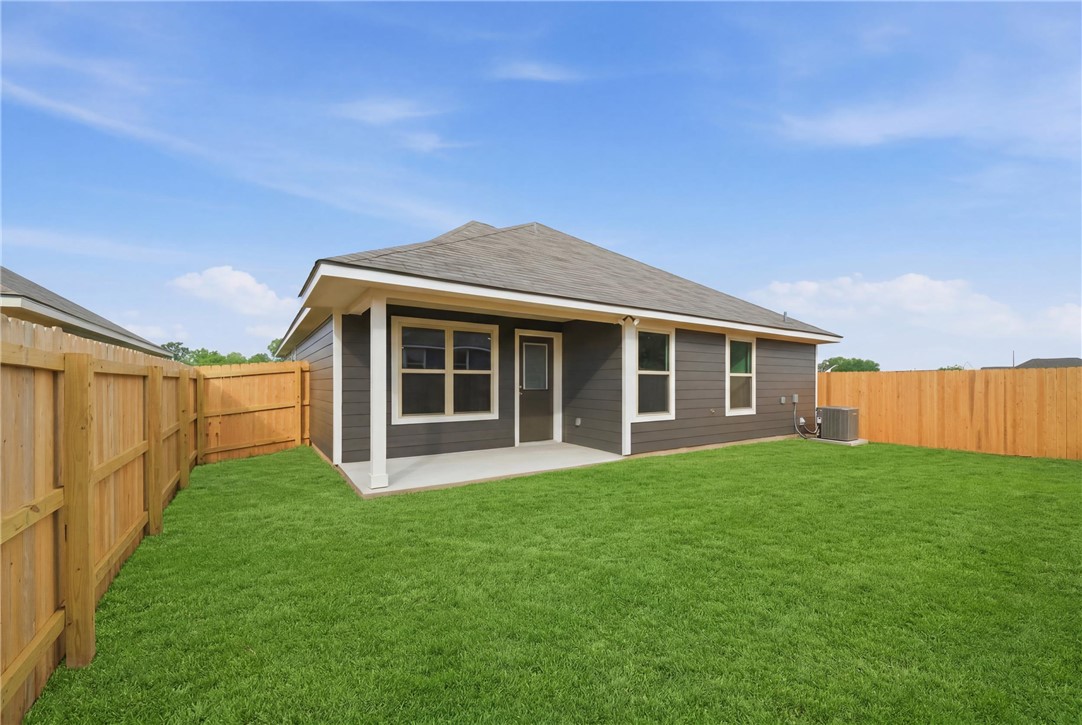 1220 High Street Navasota, TX 77868 - Photo 27 of 27 a view of a house with a yard