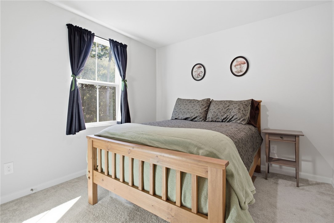 112 Wls Sta Road Seneca, SC 29678 - Photo 23 of 42 Plentiful natural light fills this bedroom highlighting the neutral walls and soft carpet flooring.