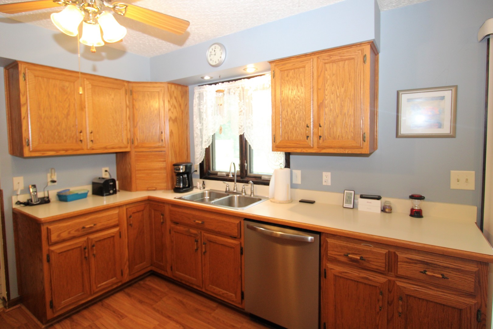 23815 Hickory Lane Minooka, IL 60447 - Photo 11 of 30 a kitchen with a sink a window and cabinets
