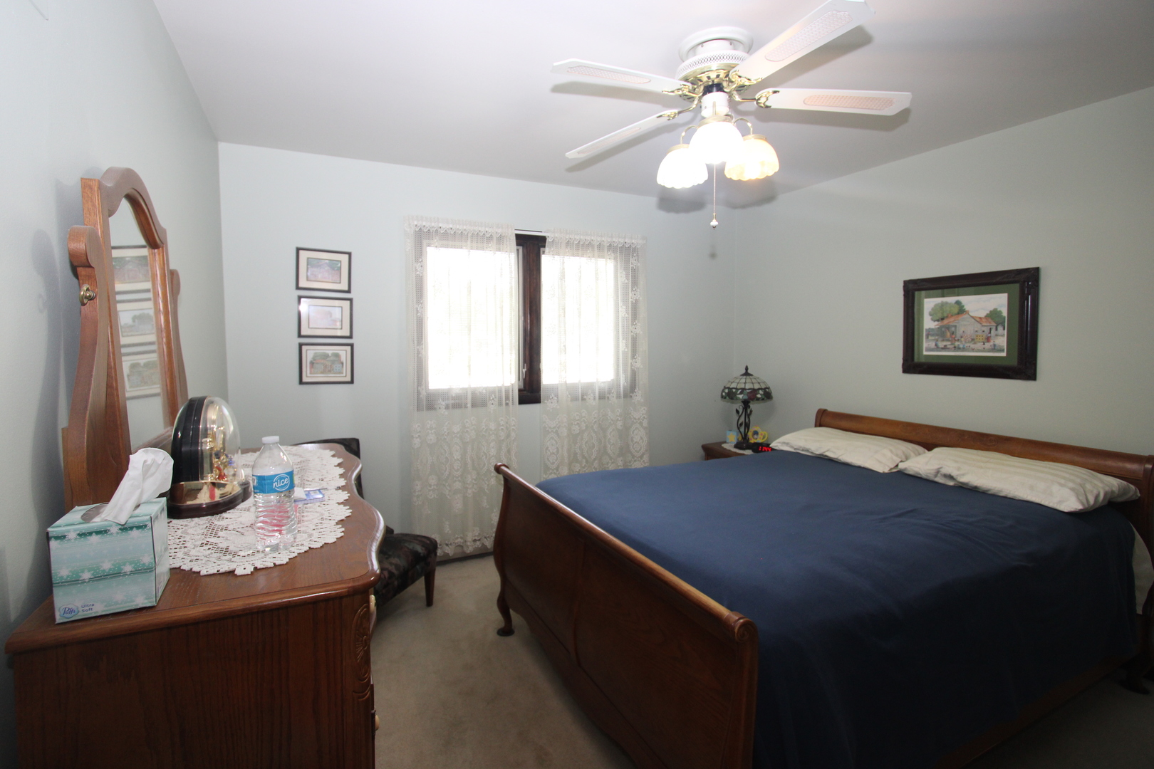 23815 Hickory Lane Minooka, IL 60447 - Photo 13 of 30 a bedroom with a bed and a chandelier