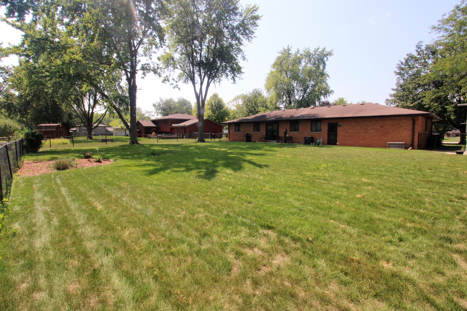 23815 Hickory Lane Minooka, IL 60447 - Photo 3 of 30 a view of a backyard with large trees