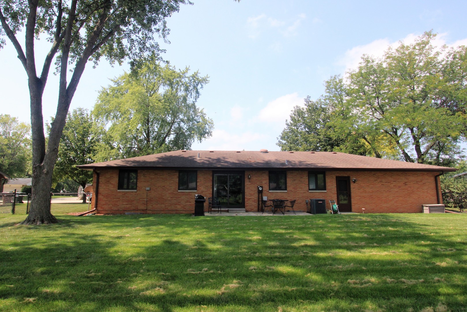 23815 Hickory Lane Minooka, IL 60447 - Photo 5 of 30 a front view of a house with a garden and trees