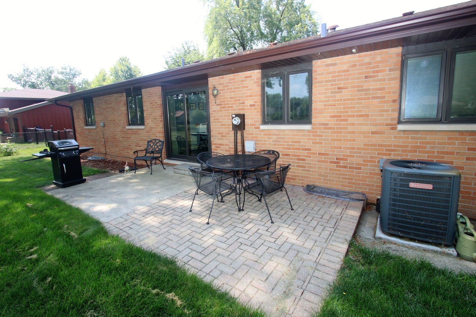 23815 Hickory Lane Minooka, IL 60447 - Photo 6 of 30 a backyard of a house with glass top table and chairs