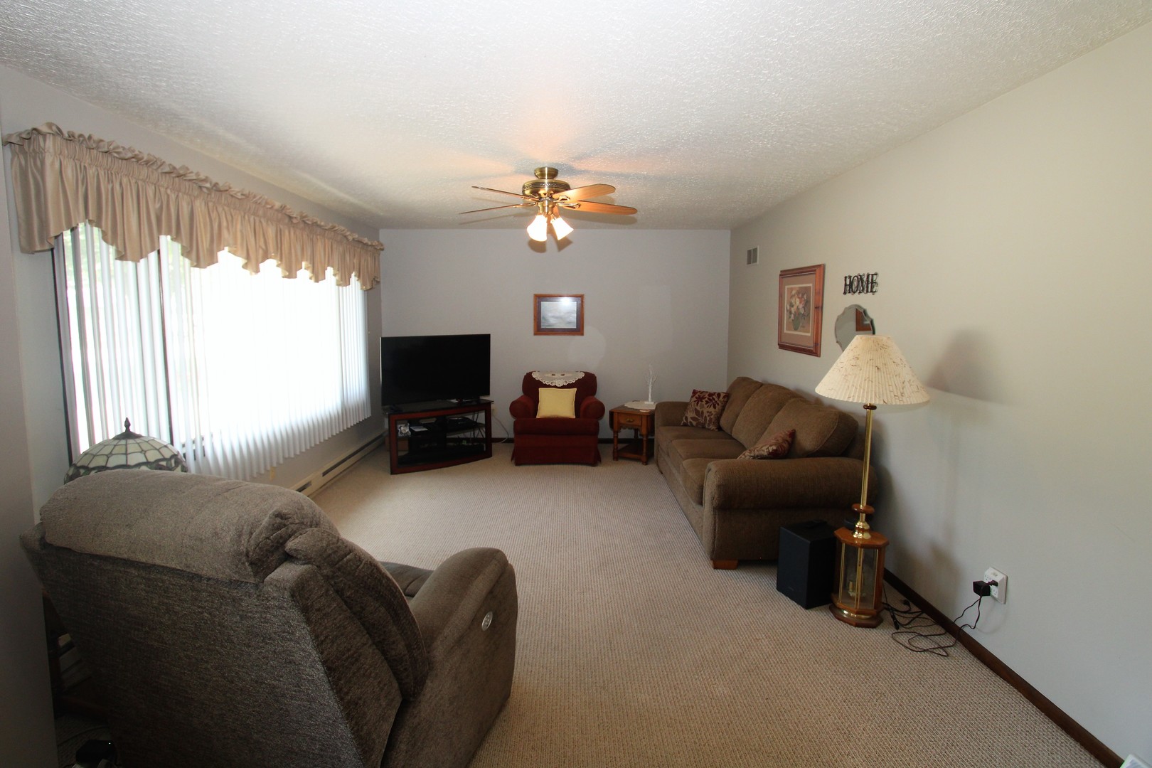 23815 Hickory Lane Minooka, IL 60447 - Photo 9 of 30 a living room with furniture and a flat screen tv