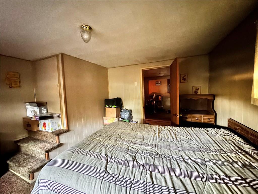 165 Low Hill Road Brownsville, PA 15417 - Photo 24 of 29 a bedroom with a large bed and a dresser