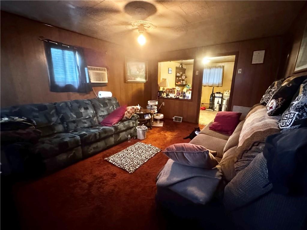 165 Low Hill Road Brownsville, PA 15417 - Photo 27 of 29 a living room with furniture fireplace and a chandelier