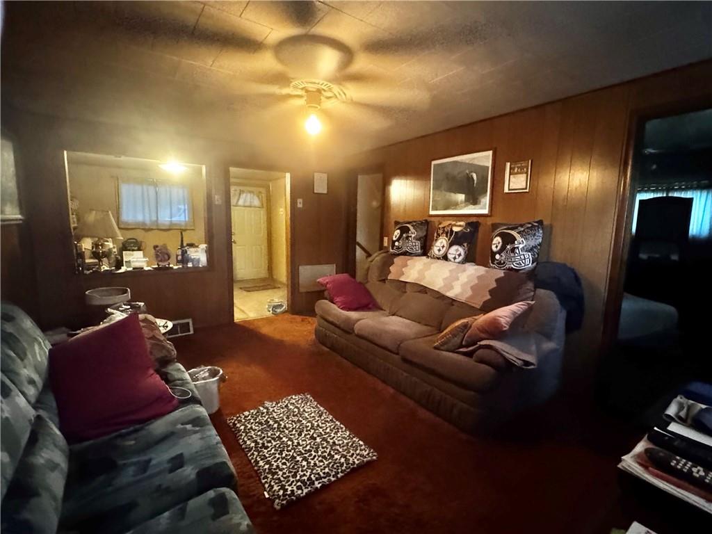 165 Low Hill Road Brownsville, PA 15417 - Photo 28 of 29 a living room with furniture and a chandelier