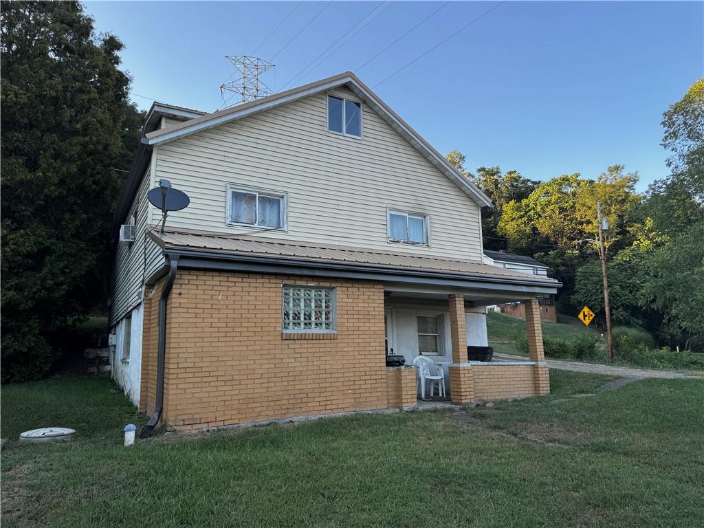 165 Low Hill Road Brownsville, PA 15417 - Photo 7 of 29 a front view of a house with a garden