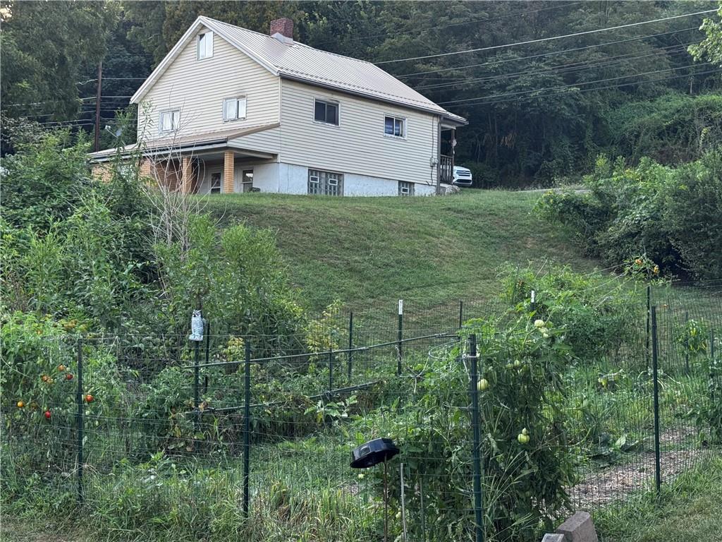 165 Low Hill Road Brownsville, PA 15417 - Photo 9 of 29 a view of house with a yard