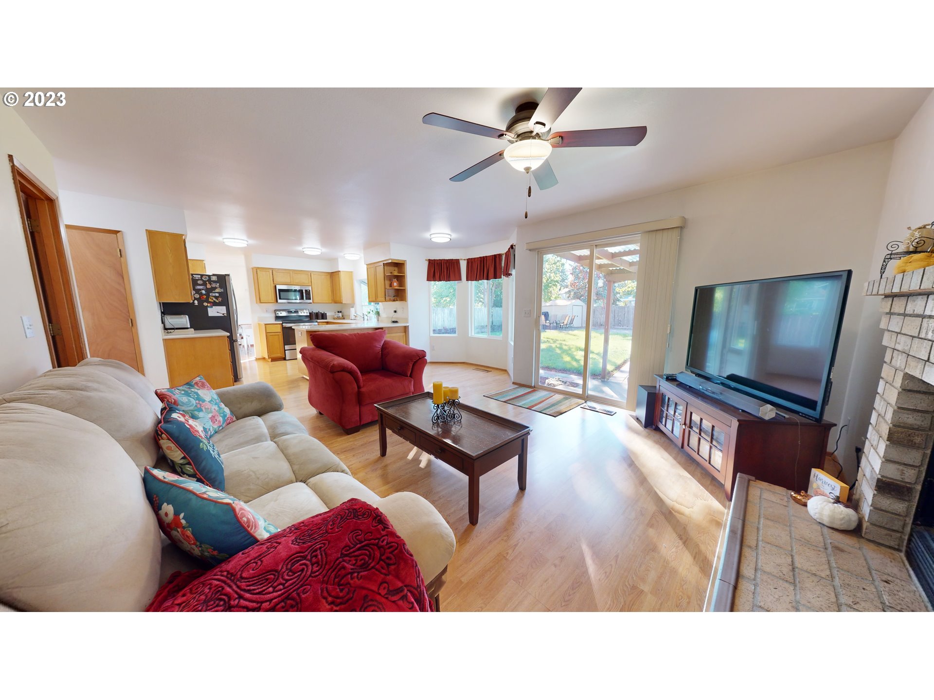 862 South 45th Place Springfield, OR 97478 - Photo 13 of 36 a living room with furniture and a flat screen tv