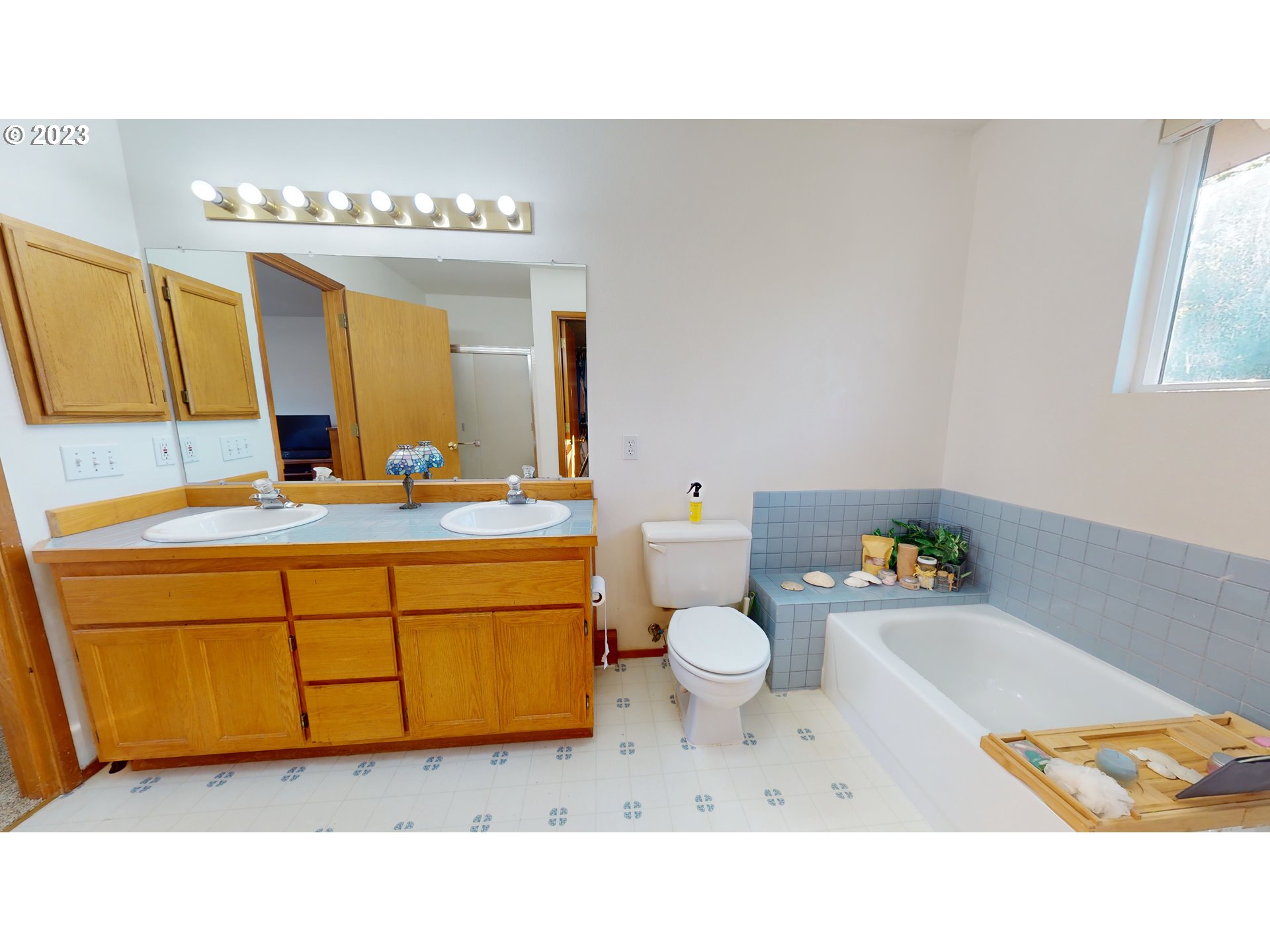 862 South 45th Place Springfield, OR 97478 - Photo 26 of 36 a bathroom with a sink vanity mirror and toilet