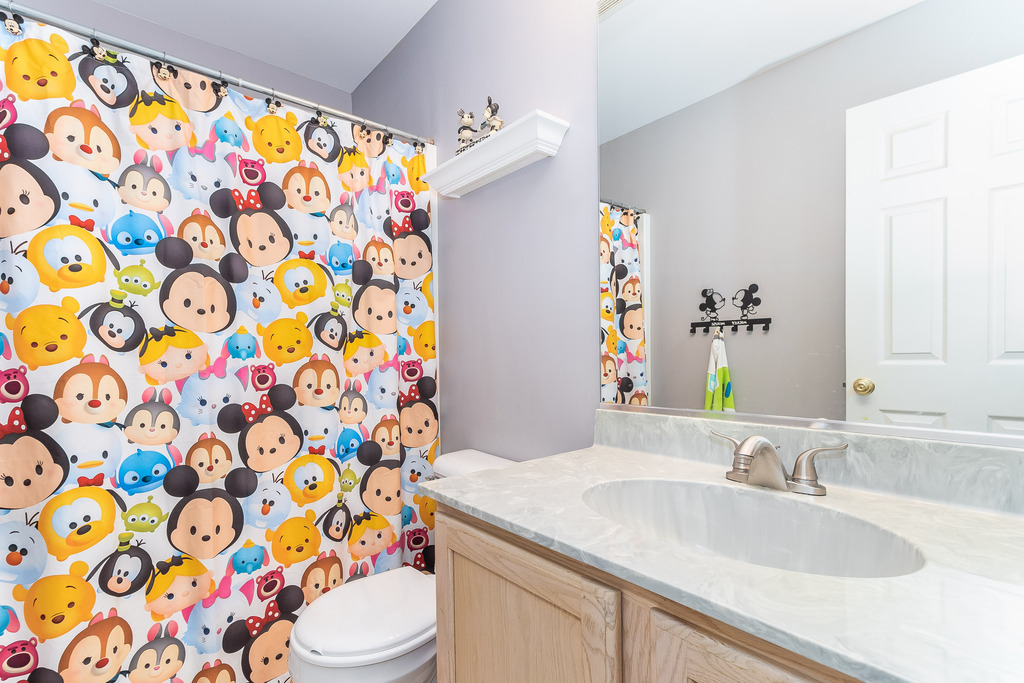 1950 Lakeside Drive Montgomery, IL 60538 - Photo 13 of 15 a bathroom with a sink and a mirror