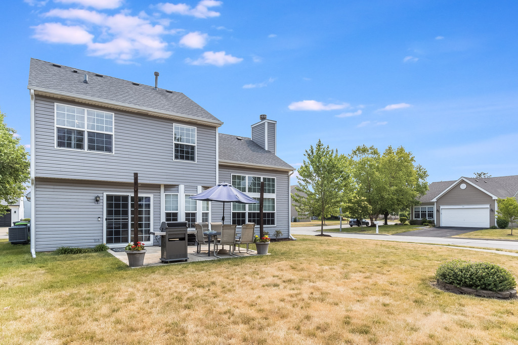 1950 Lakeside Drive Montgomery, IL 60538 - Photo 15 of 15 a view of a house with swimming pool and sitting area