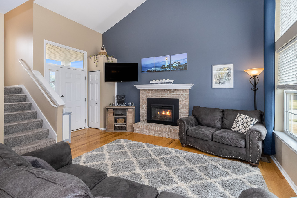 1950 Lakeside Drive Montgomery, IL 60538 - Photo 2 of 15 a living room with furniture and a fireplace