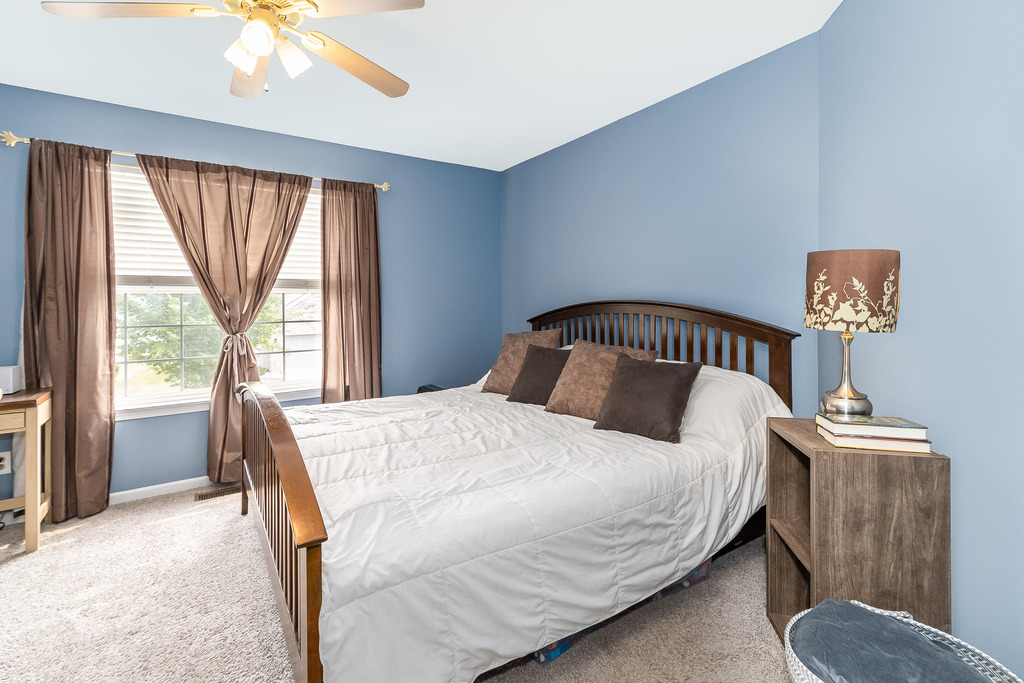 1950 Lakeside Drive Montgomery, IL 60538 - Photo 8 of 15 a bedroom with a bed and wooden floor