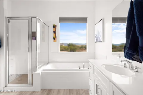 a bathroom with a sink a bath tub and a sink