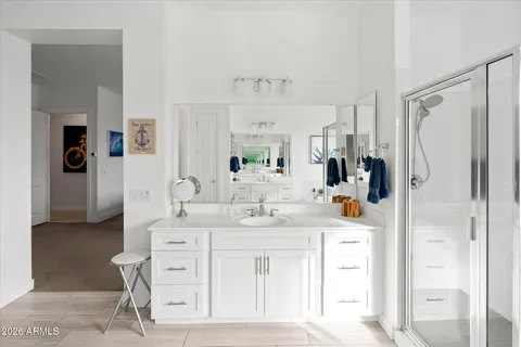 a spacious bathroom with a double vanity sink mirror and