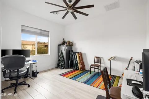 a room with gym equipment and windows