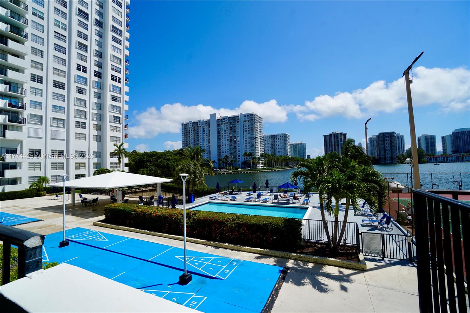 2750 Northeast 183rd Street, Unit 2304 Aventura, FL 33160 - Photo 11 of 12 a view of a chairs and table in the patio