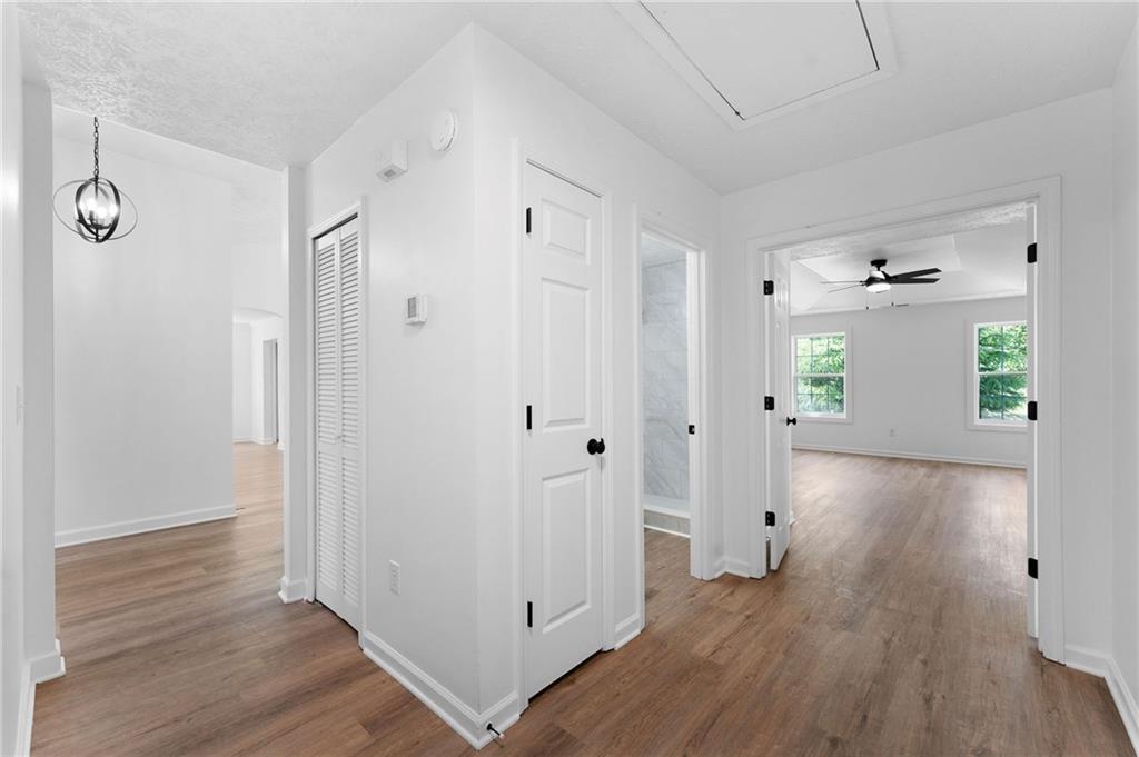 20 Mallet Pointe Street Northeast Cartersville, GA 30121 - Photo 19 of 37 a view of a hallway with wooden floor