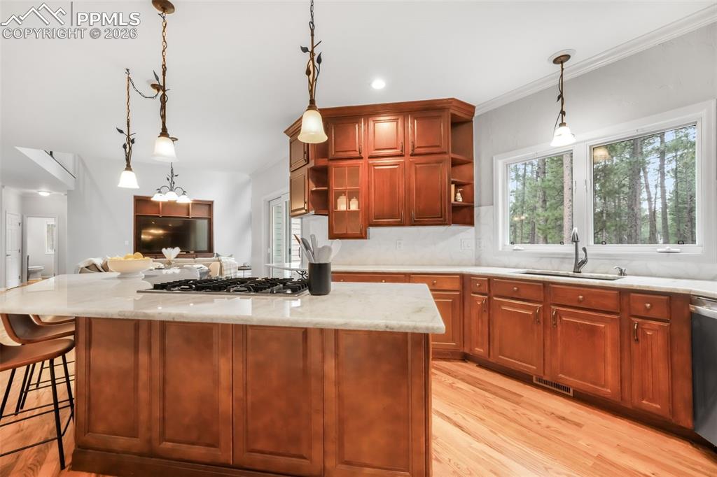 19010 Deerfield Road Monument, CO 80132 - Photo 15 of 50 a kitchen with a sink a counter space appliances and cabinets