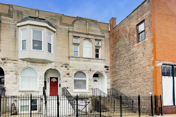 a front view of a house with glass windows