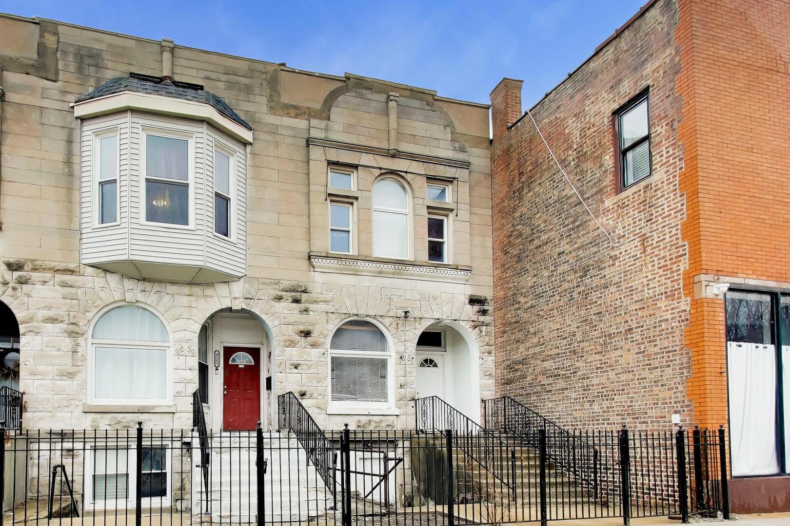 a front view of a house with glass windows