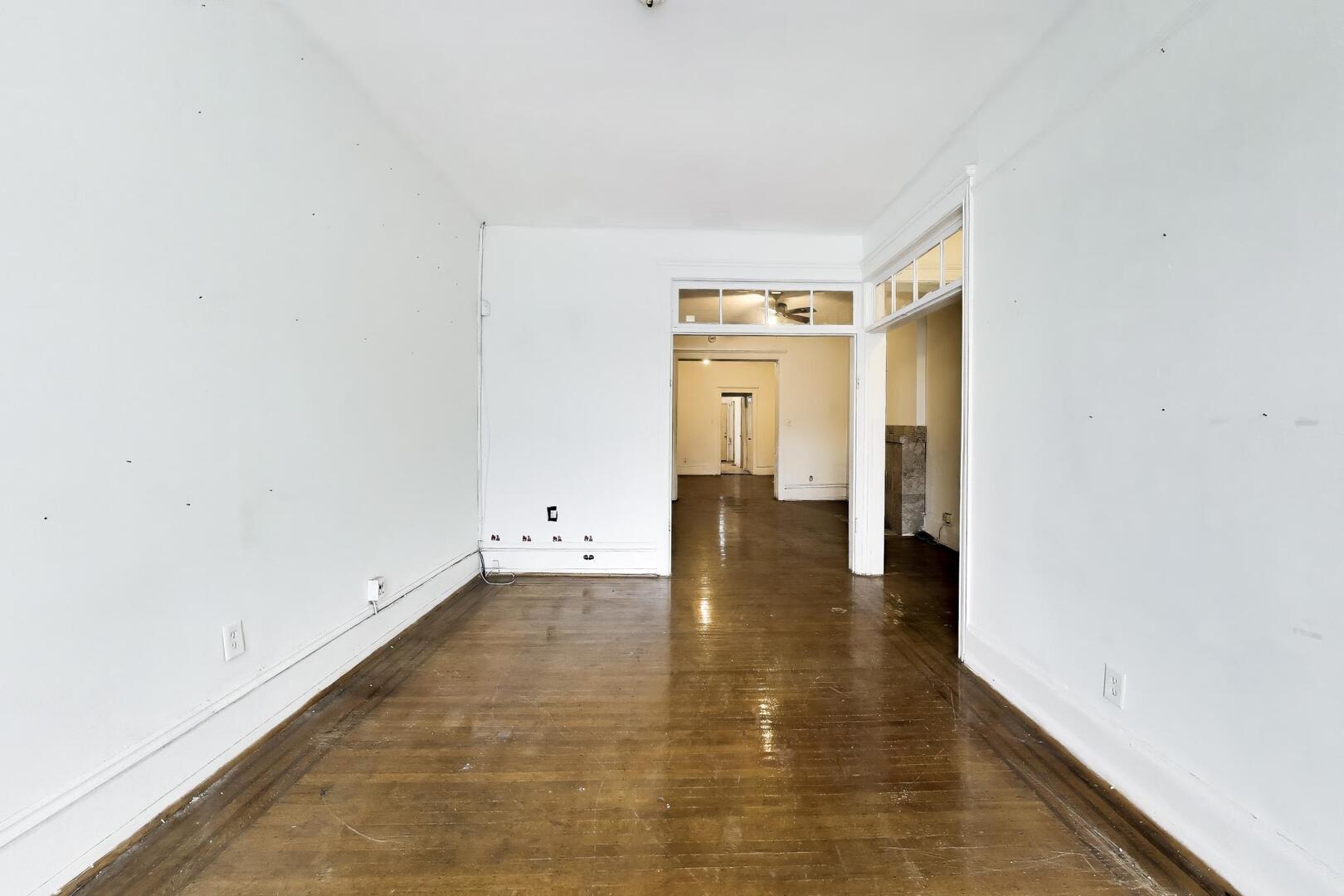 4505 South Indiana Avenue Chicago, IL 60653 - Photo 5 of 31 a view of empty room with wooden floor
