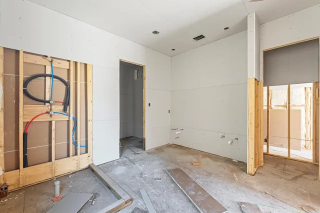 a view of entryway with wooden floor and a front door