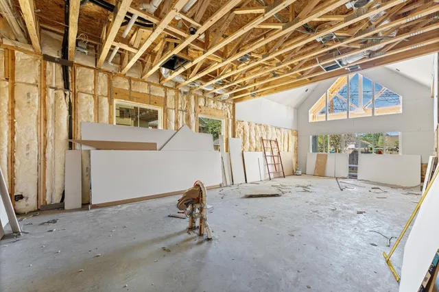 a view of a room with large windows