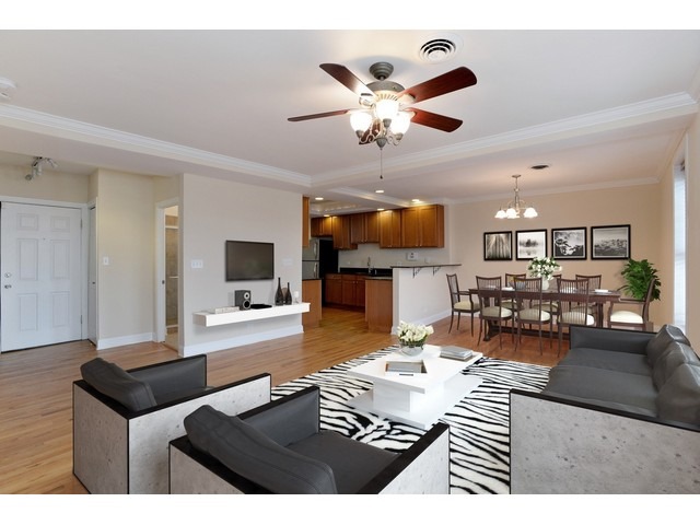 4105 North Sheridan Road, Unit 3N Chicago, IL 60613 - Photo 2 of 10 a living room with furniture and a flat screen tv