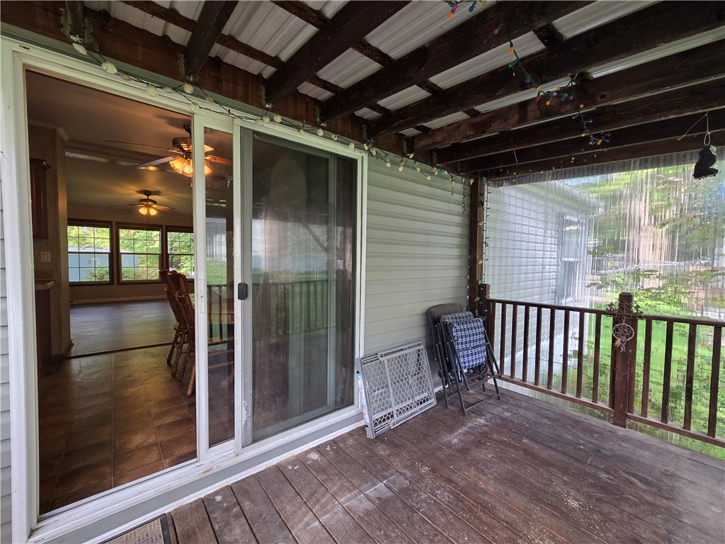 5337 State Rte 26 Triangle, NY 13862 - Photo 20 of 22 Sliding doors open from the covered wooden porch directly into the main living areas.
