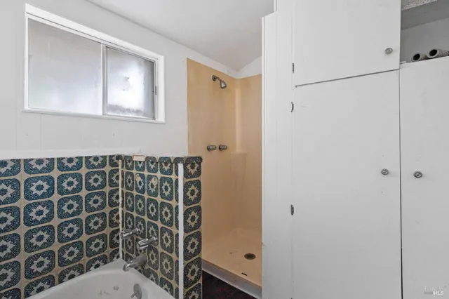 a bathroom with a toilet a sink and bathtub