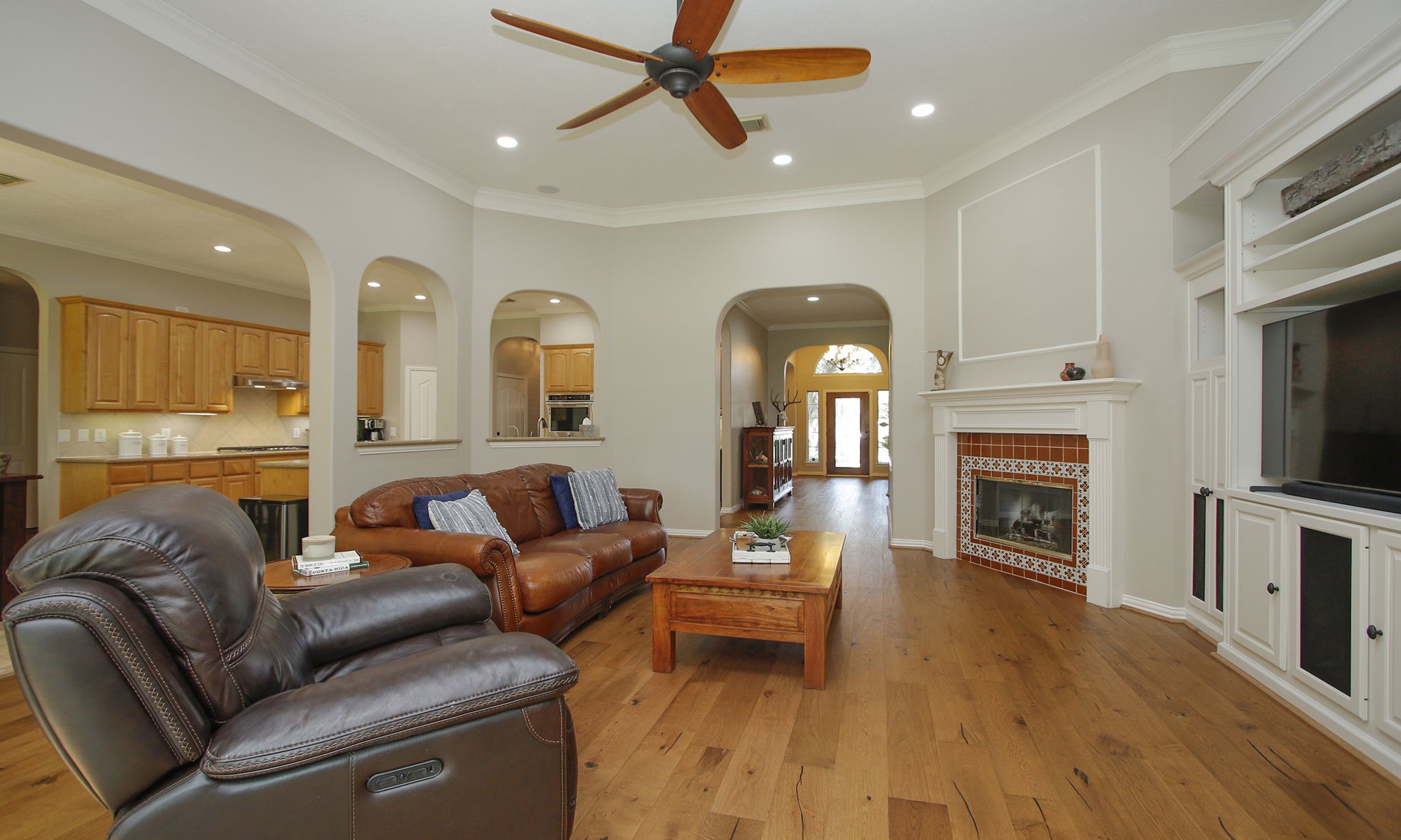 20110 Stormy Pine Lane Spring, TX 77379 - Photo 13 of 44 This family room is enhanced by beautiful archways, crown molding and fresh neutral paint which can be seen throughout the home.