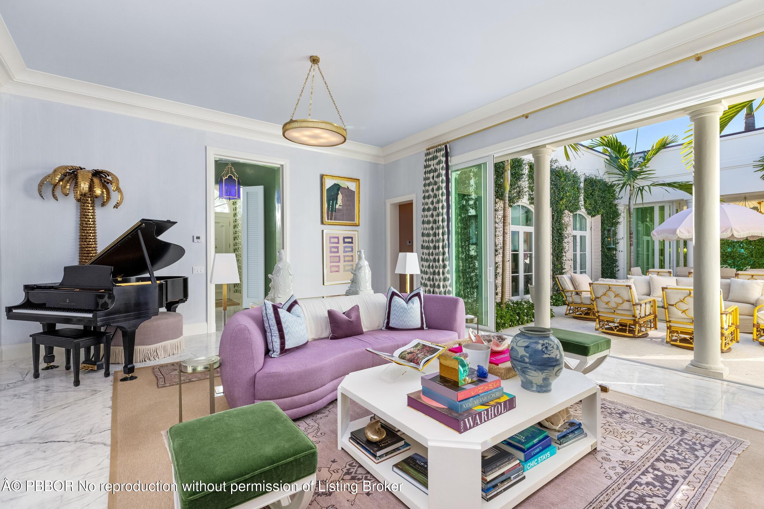 309 Chapel Hill Road Palm Beach, FL 33480 - Photo 6 of 50 a living room with furniture a rug and a chandelier