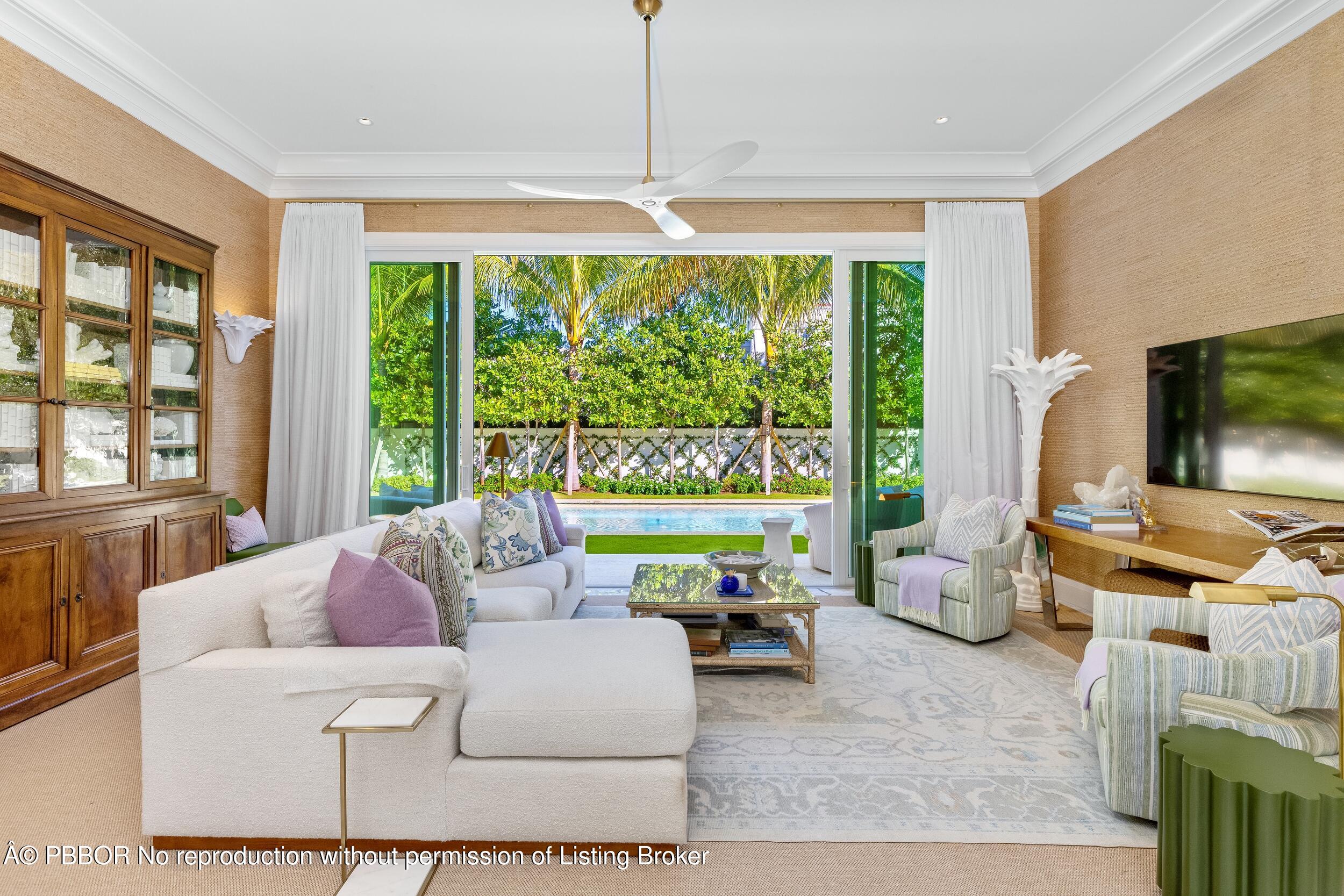309 Chapel Hill Road Palm Beach, FL 33480 - Photo 10 of 50 a living room with furniture and a flat screen tv
