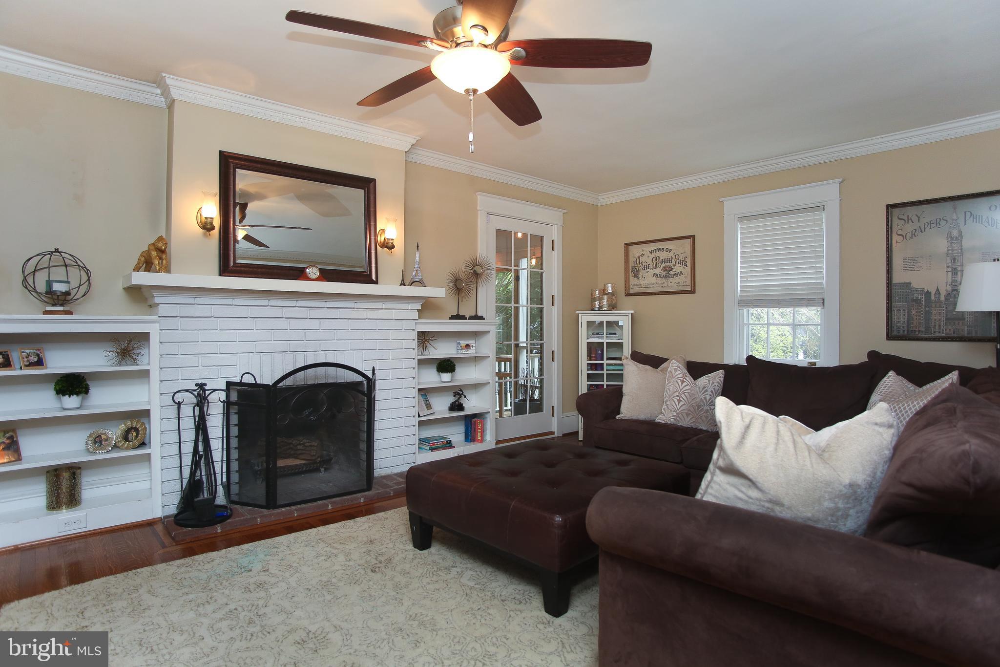 213 Hewett Road Wyncote, PA 19095 - Photo 5 of 40 Living room with brick fireplace