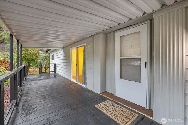 a view of a porch with wooden floor and outer view