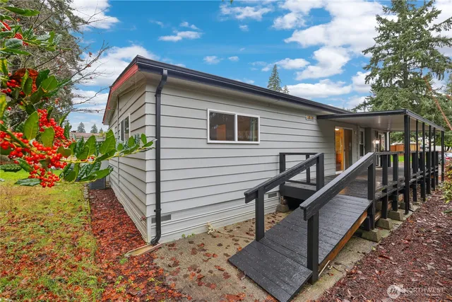 a view of a house with wooden fence
