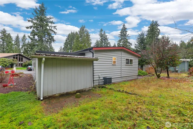 a backyard of a house with yard and garage
