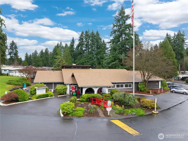 a aerial view of a house with garden space and street view