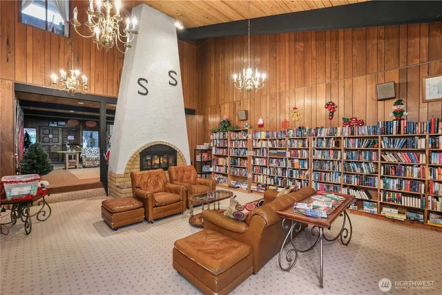 a reading room with furniture and wooden floor