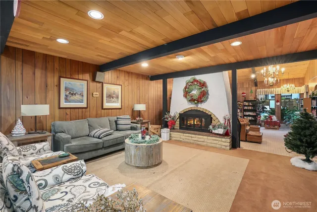 a living room with furniture a couch and a potted plant