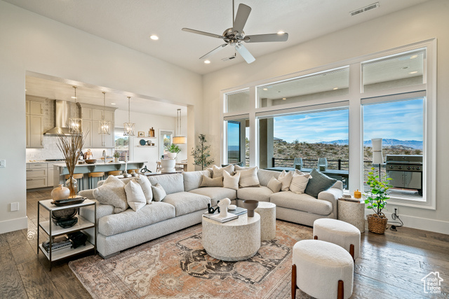 6026 Zen Trail Way St. George, UT 84790 - Photo 9 of 41 Living room with dark wood-style floors, a ceiling fan, recessed lighting, a chandelier, and a mountain view